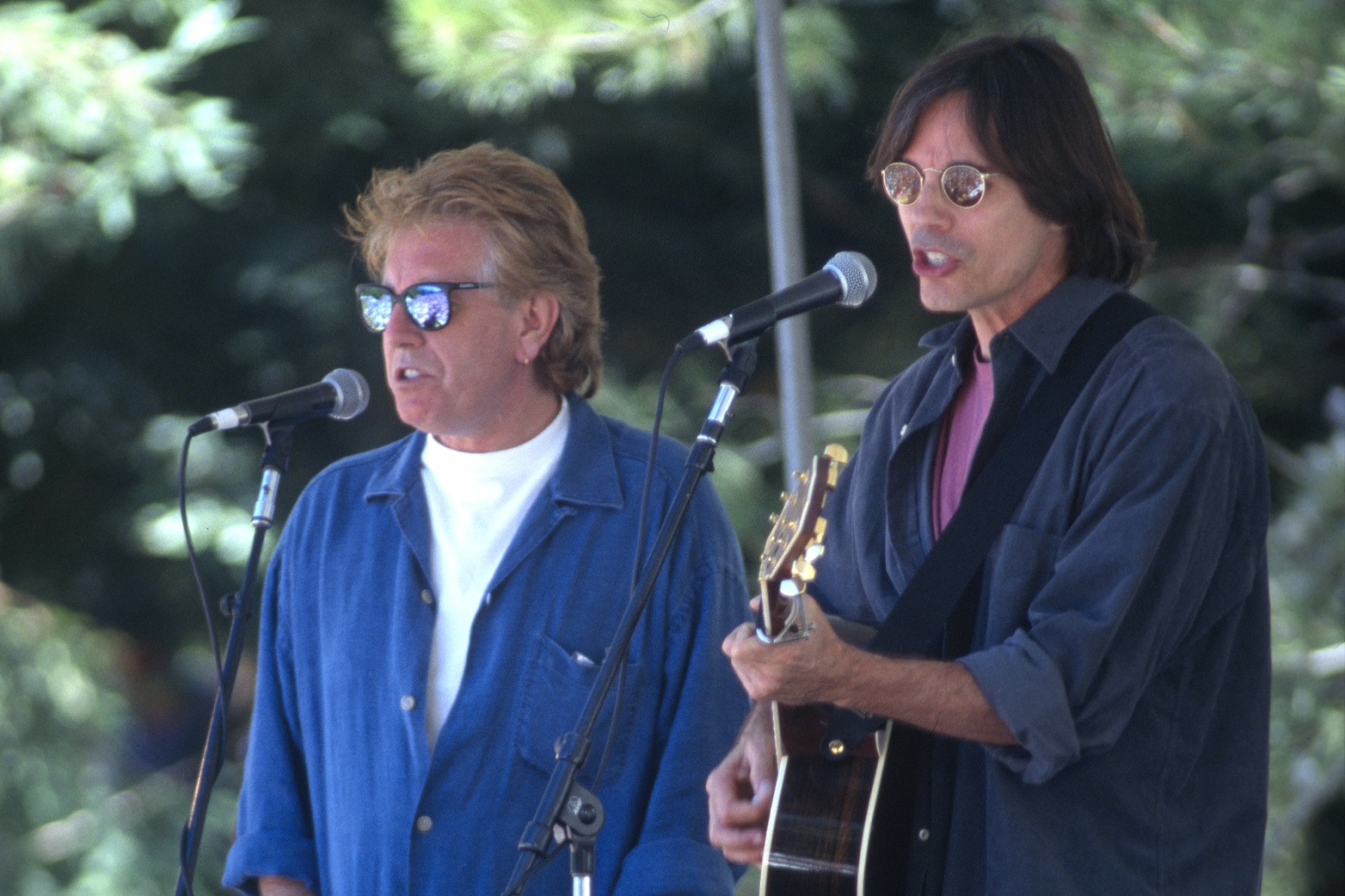 Graham Nash and Jackson Browne perform during a No Nukes concert to commemorate the Hiroshima bombing at San Lorenzo park on August 5, 1995 in Santa Cruz, California. TIM MOSENFELDER/GETTY IMAGES